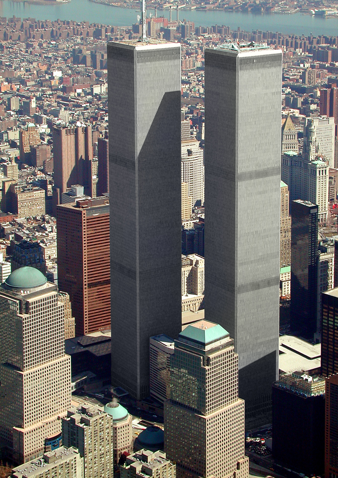 Figure 12. (~ March 2001) Aerial view of World Trade Center, and surrounding area of New York, Downtown Manhatten is in the foreground, looking north easterly.